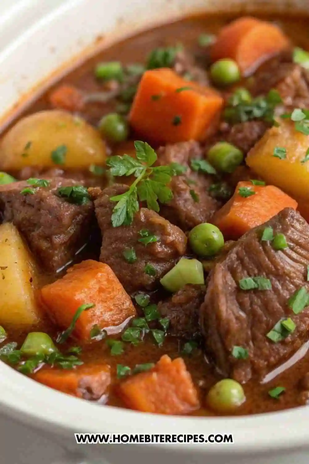 Classic hearty beef stew with tender beef chunks, potatoes, carrots, and peas in a rich savory broth.