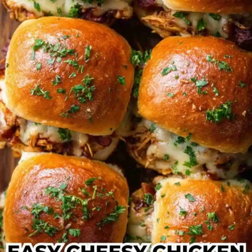 Golden brown chicken sliders topped with melted cheese, fresh parsley, and brushed with garlic butter — perfect for parties or game day.