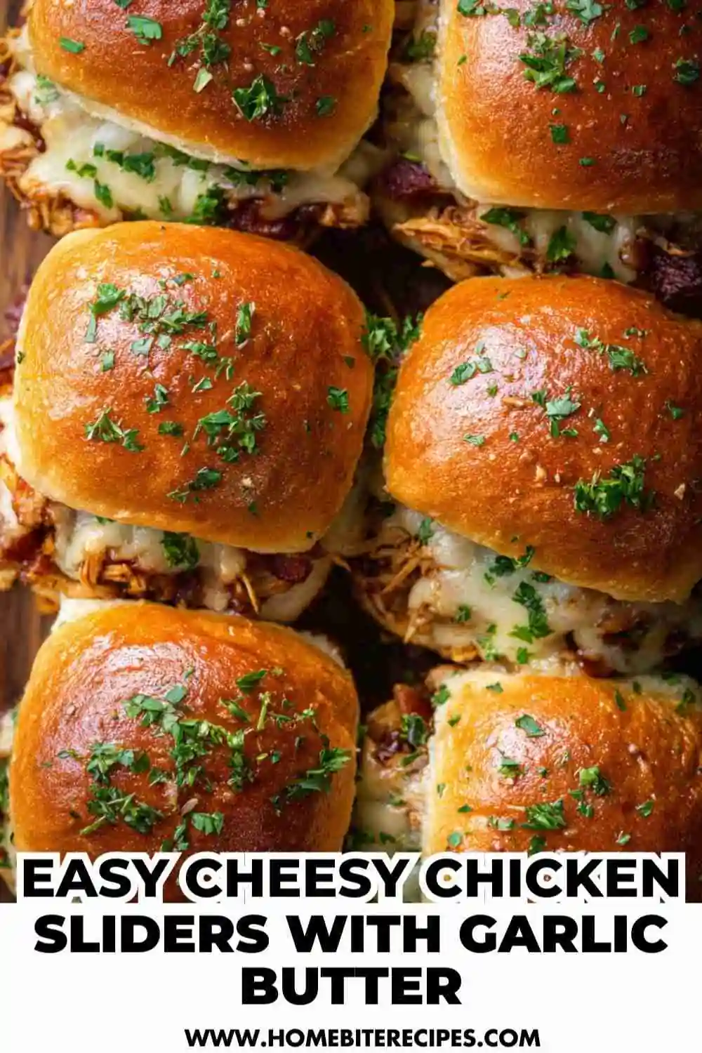 Golden brown chicken sliders topped with melted cheese, fresh parsley, and brushed with garlic butter — perfect for parties or game day.