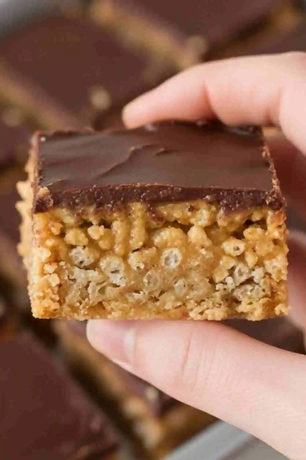 Close-up of an easy no-bake peanut butter bar with chocolate topping.