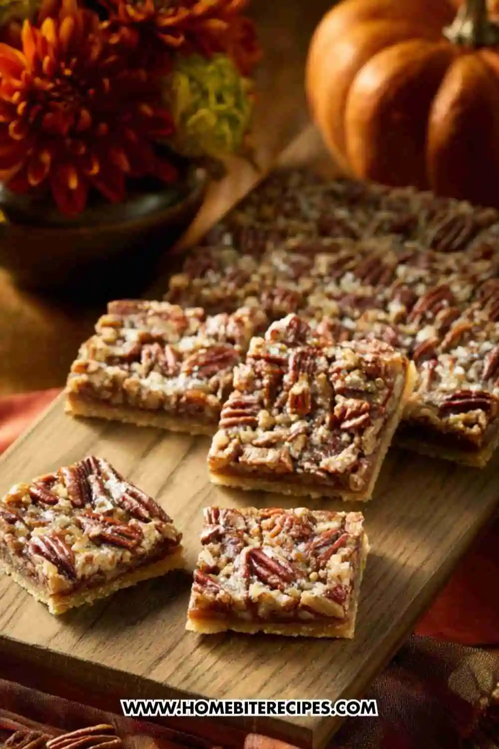 Easy Pecan Pie Bars with a golden crust and caramelized pecan topping, served on a wooden board.