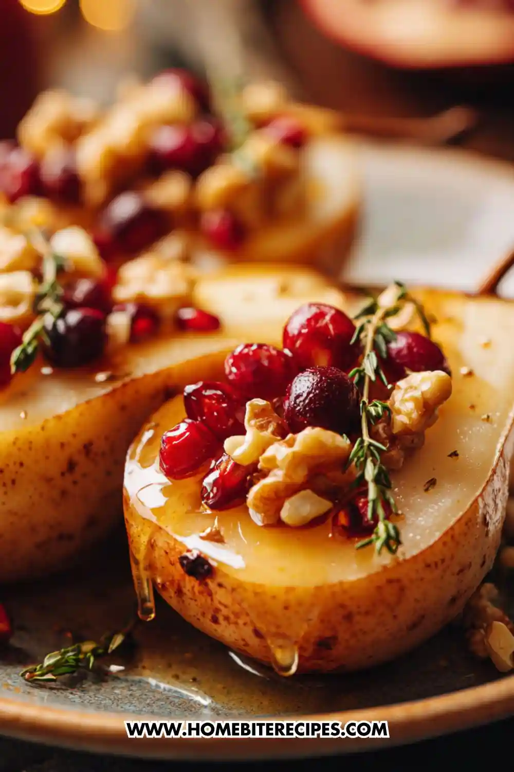 Close-up of honey-baked pear halves topped with cranberries, toasted walnuts, and fresh thyme, drizzled with warm honey on a rustic plate.