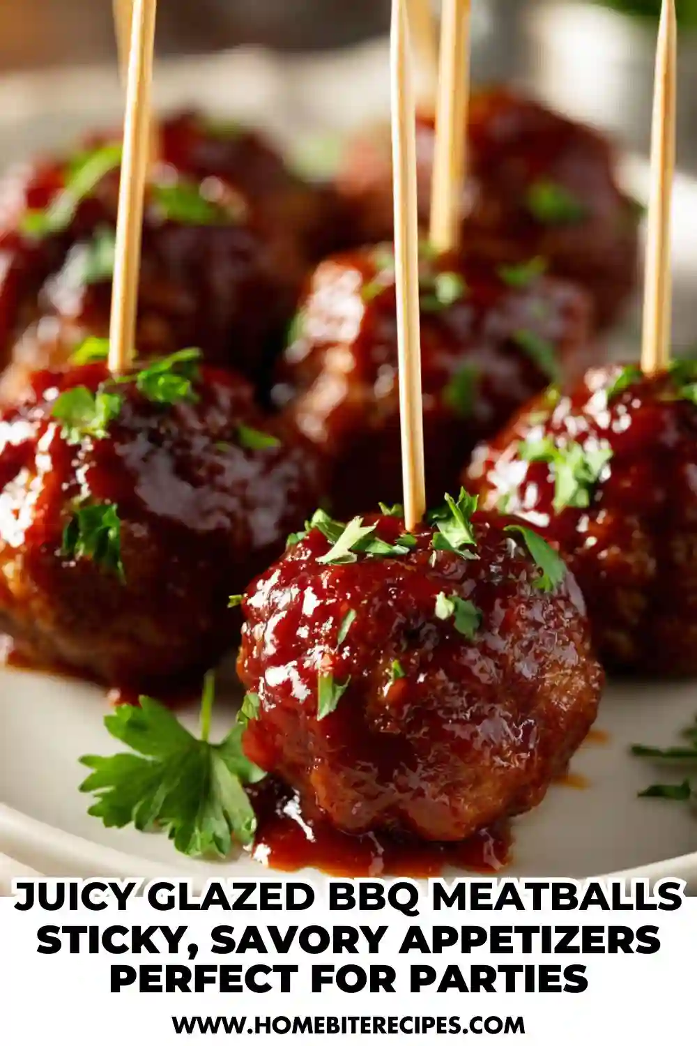 Close-up of juicy glazed BBQ meatballs garnished with parsley and served on toothpicks, ready for party appetizers.