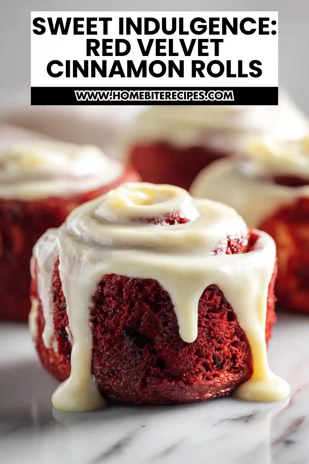 Close-up of soft and tender red velvet cinnamon rolls topped with creamy white frosting, showcasing their rich red color and gooey texture.