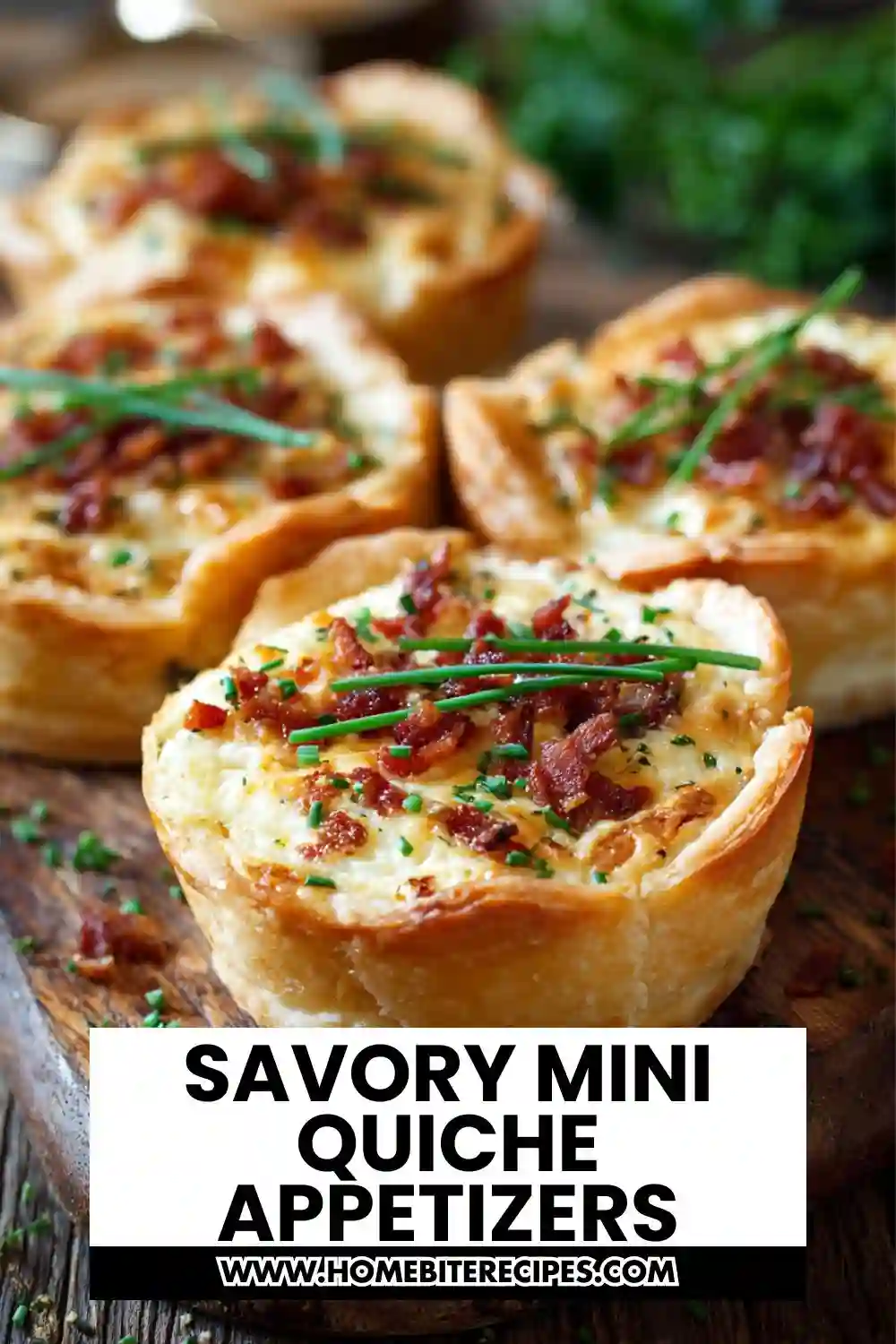 A close-up of savory mini quiche appetizers with golden flaky crust, creamy egg filling, crispy bacon, and fresh chives on top, arranged on a wooden board.