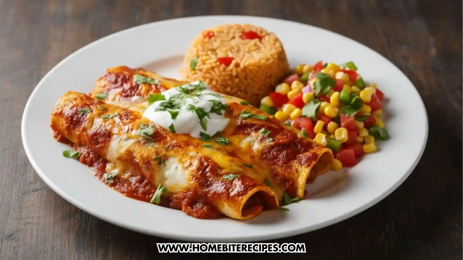 Close-up image of two cheesy chicken enchilada topped with melted cheese, red enchilada sauce, dollops of sour cream, and fresh chopped cilantro served with Mexican rice on a white plate alongside a corn salad with diced tomatoes, bell peppers, and a hint of cilantro