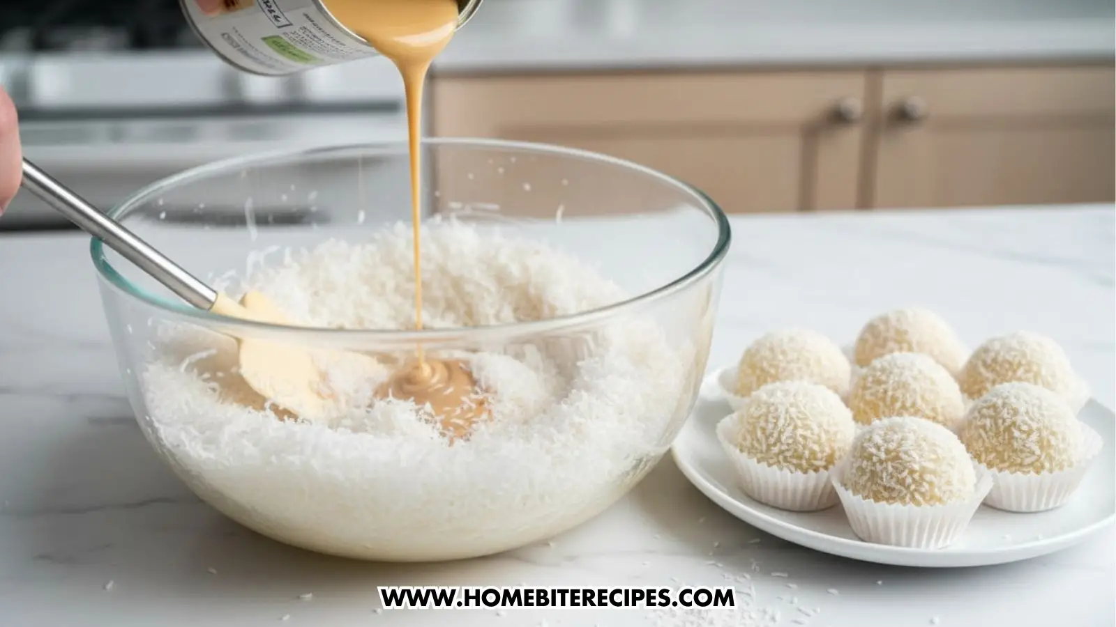 A hand combining in a mixing bowl, shredded coconut with sweetened condensed milk to prepare these No Bake Coconut Balls