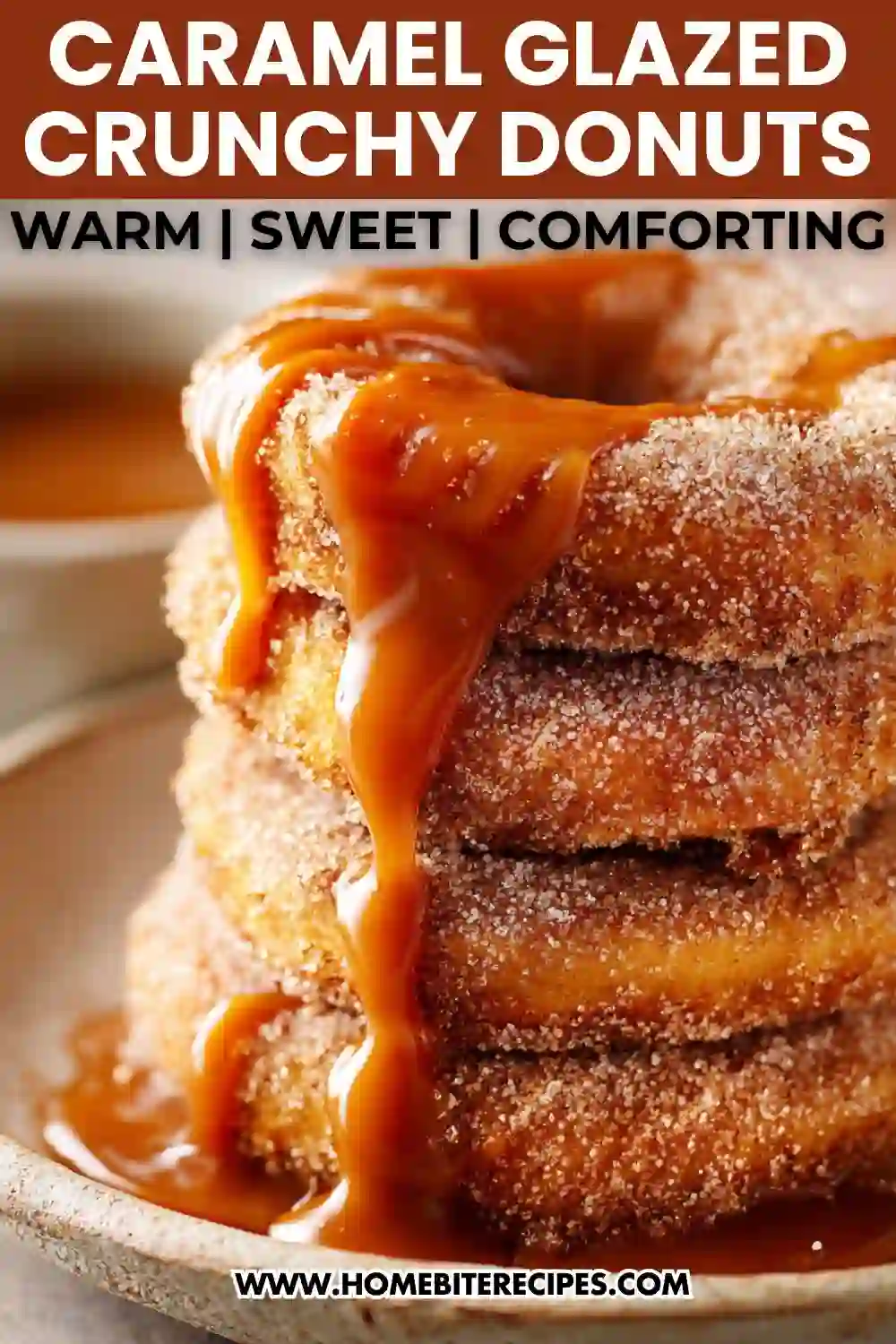 Stack of cinnamon sugar donuts covered in warm dripping caramel sauce on a plate.