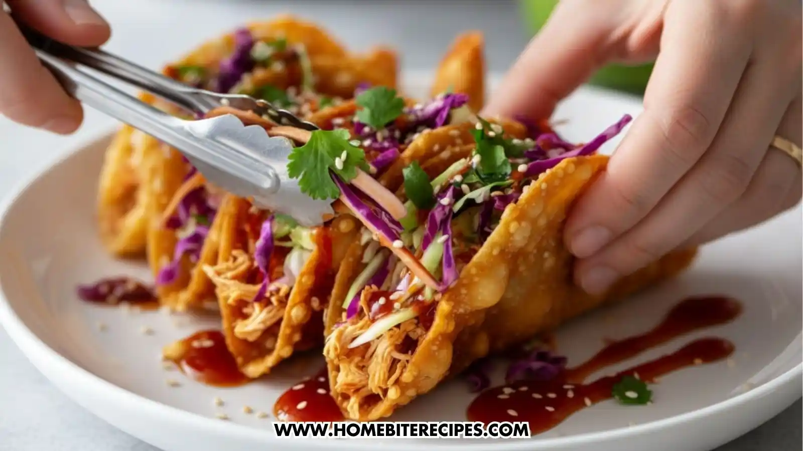 Crispy fried taco shells filled with shredded chicken, colorful cabbage slaw, cilantro, sesame seeds, and sweet chili sauce.