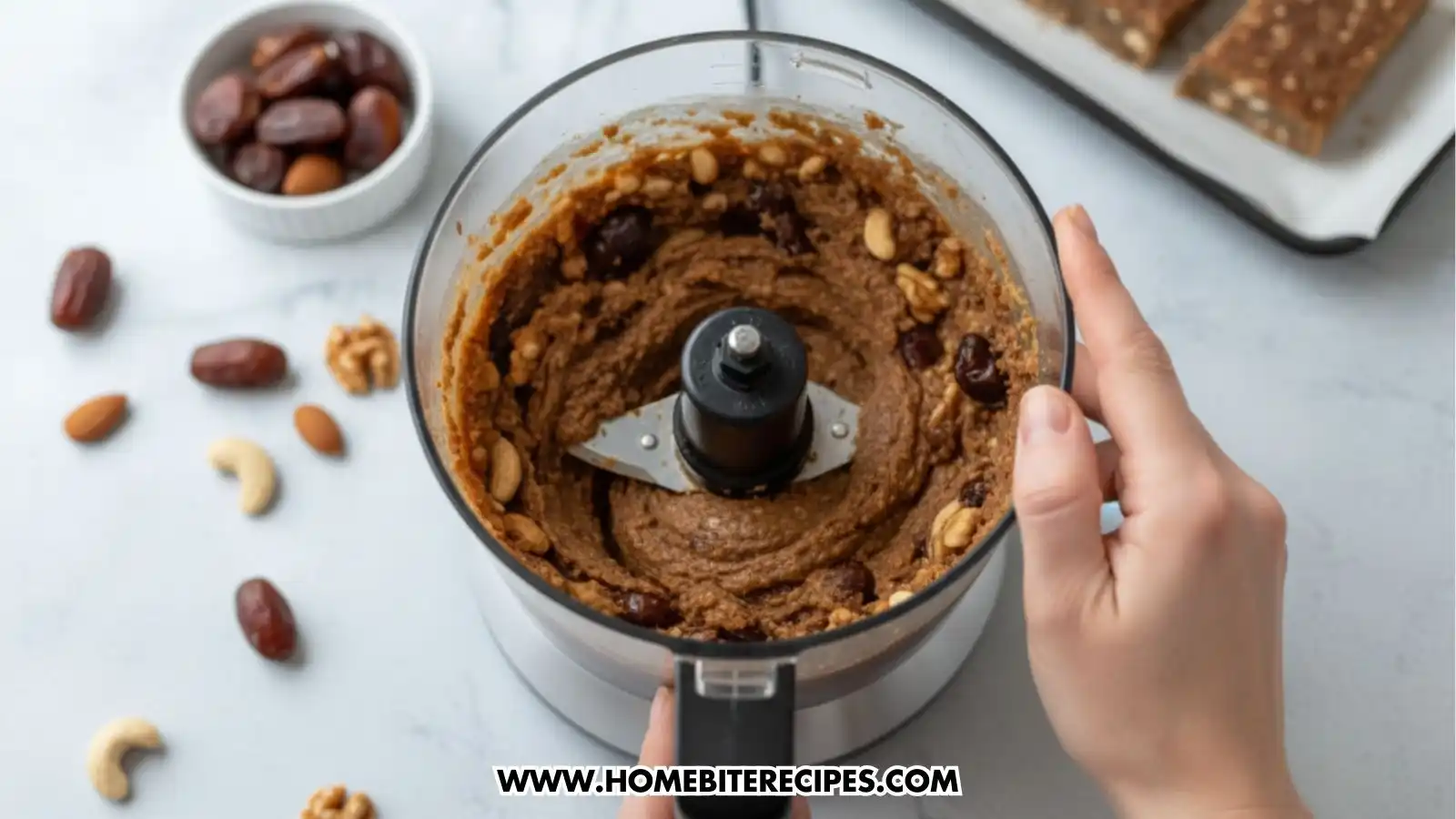 Close-up image of a chewy no-bake date mixture made with nuts and only five ingredients, being blended