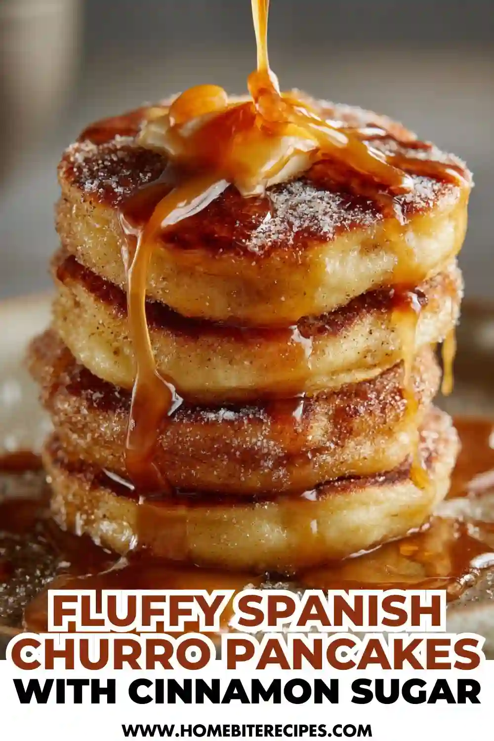 A stack of fluffy churro-inspired pancakes coated in cinnamon sugar and drizzled with syrup, creating a warm and indulgent breakfast dish.