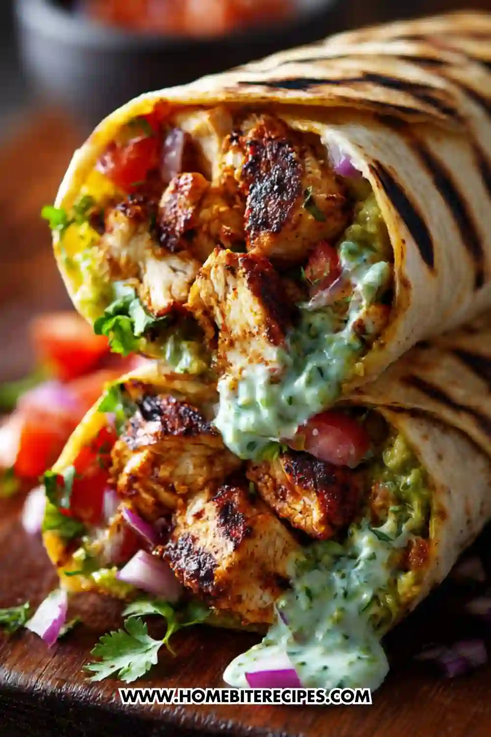 Grilled chicken wrap filled with seasoned chicken, guacamole, fresh vegetables, and creamy cilantro sauce in a toasted tortilla.