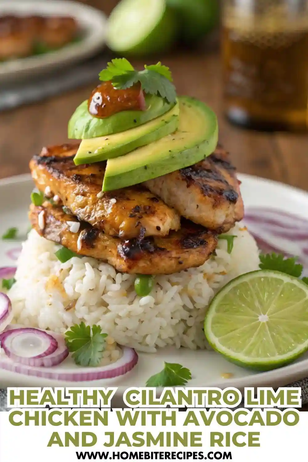 Grilled cilantro lime chicken served over jasmine rice and topped with fresh avocado slices, garnished with lime and cilantro.