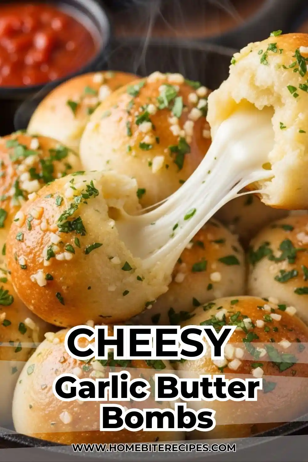Golden garlic butter bread bites topped with parsley, showing a melted mozzarella cheese pull in a cast-iron skillet.