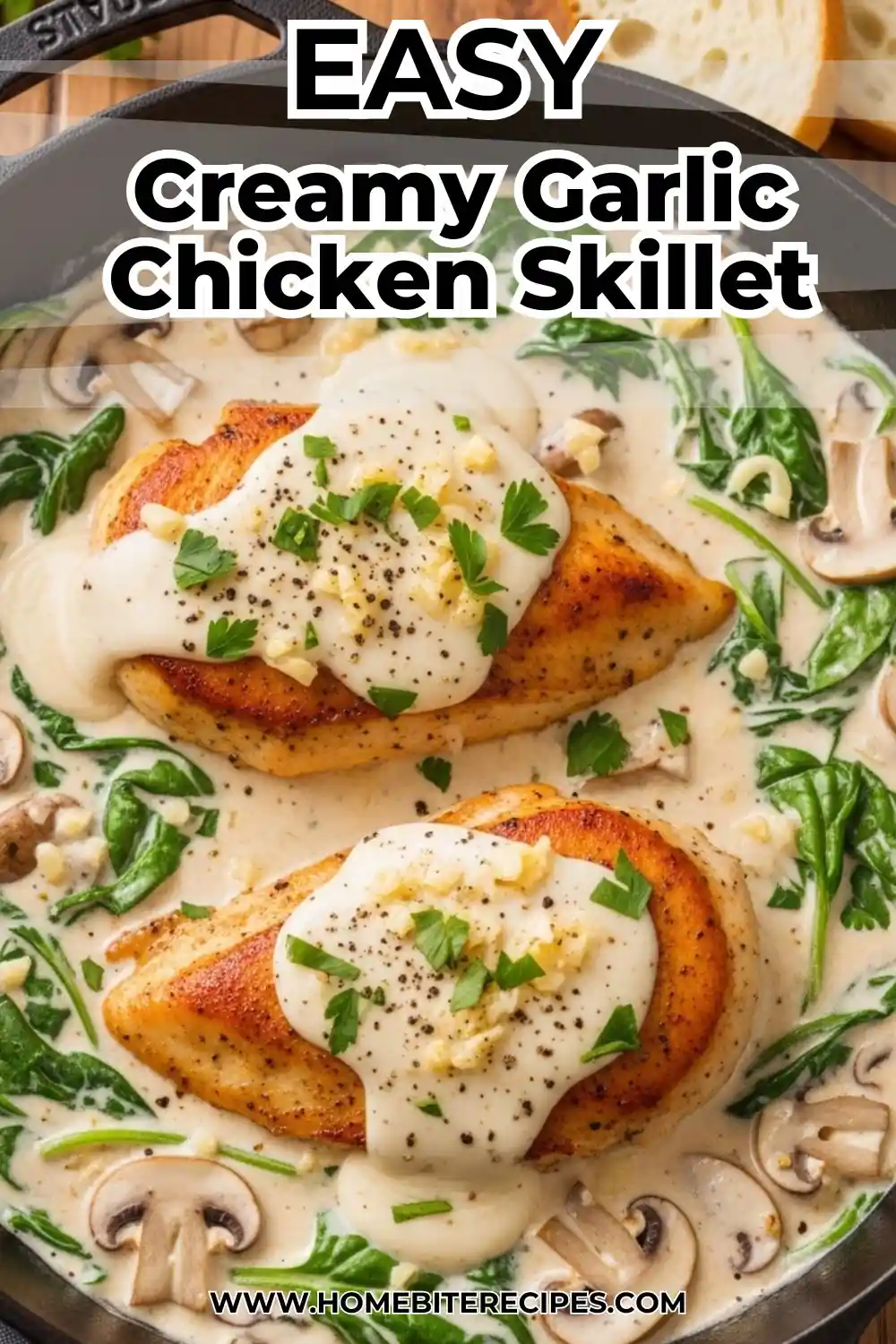 One-pan creamy garlic chicken with spinach and mushrooms in a cast-iron skillet, smothered in a white parmesan cream sauce.