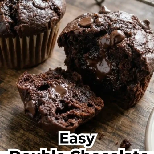 Close-up of dark chocolate fudge muffins with melty chocolate chips on top, showing a moist and fudgy interior